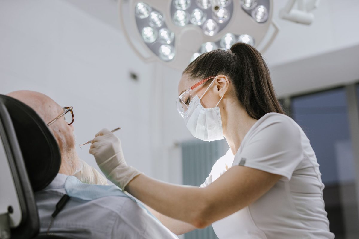 A dentist examining a patient in a modern clinic