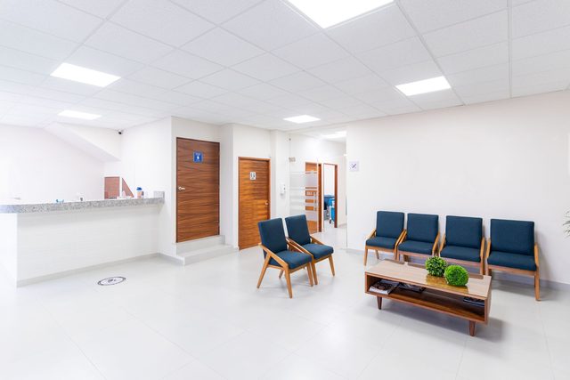 A bright dental waiting room and reception desk